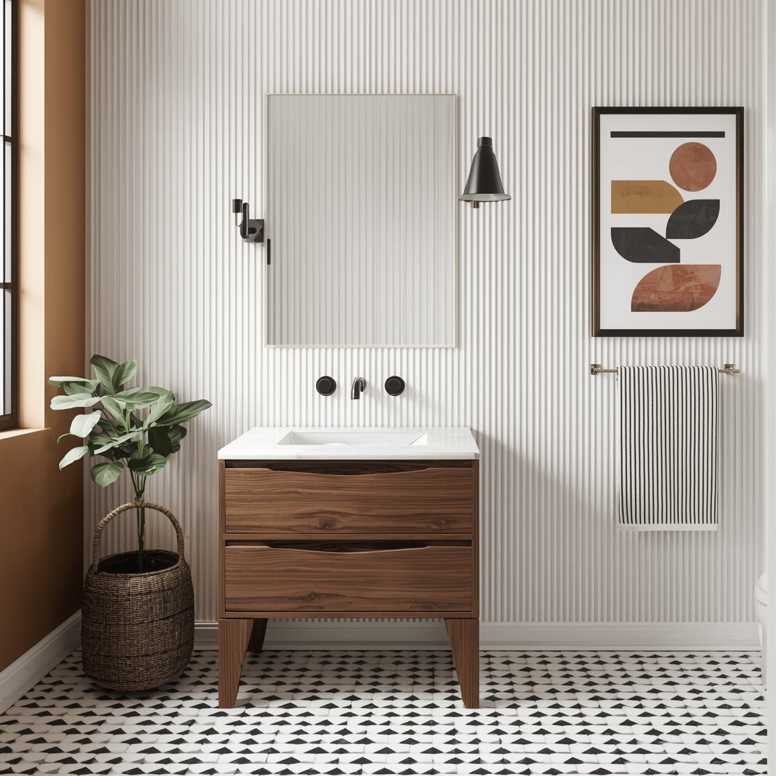 Medium straight-on photorealistic shot emphasizing graphic geometry: matte white fluted wall tile on the sink wall with adjacent warm white painted walls; small black-and-white triangle mosaic floor forming a dynamic pattern; walnut pedestal vanity; rectangular black-edged mirror; single-hole chrome faucet; black cone sconce with brass accents; black-striped Turkish hand towel; abstract art print with geometric blocks in mustard, clay, and black. Crisp, balanced lighting, no people.